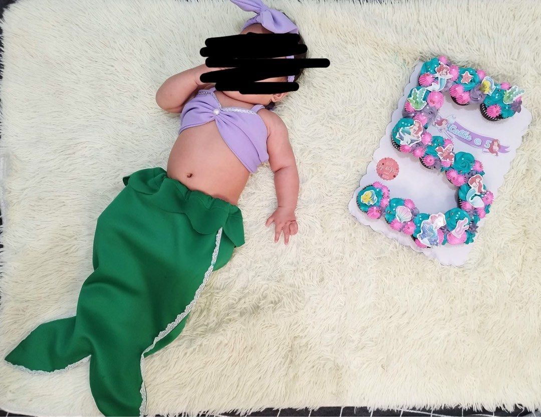 Mermaid Milestones costume (Category: Babies & Kids Fashion) located in San Mateo. Submitted by andra.dc (Listing ID 1471122130, Image 1). Description: - Adorable mermaid costume set for baby milestones and photoshoots - Includes a purple halter crop top, matching bow headband, and green mermaid tail skirt with white lace trim - Made with soft fabric that is easy to put on - Worn only once for a monthly birthday shoot.