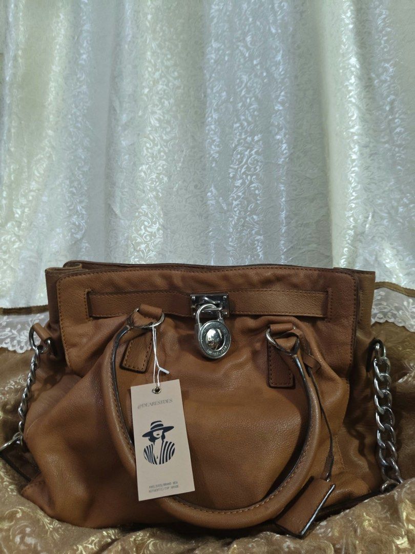 Michael Kors Hamilton Large Satchel (Category: Luxury Bags & Wallets) located in Laguindingan. Submitted by dearestfinds (Listing ID 1471207721, Image 1). Description: Not obvious watermarks on leather, pure leather, with complete accessories .