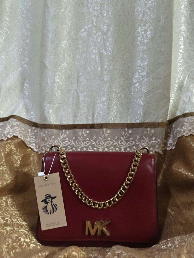 Michael Kors Mott Chain Shoulder Bag (Category: Luxury Bags & Wallets) located in Laguindingan. Submitted by dearestfinds (Listing ID 1471249017, Image 1). Description: Michael Kors Mott Chain Shoulder Bag in Burgundy color Leather with gold chain and long strap.