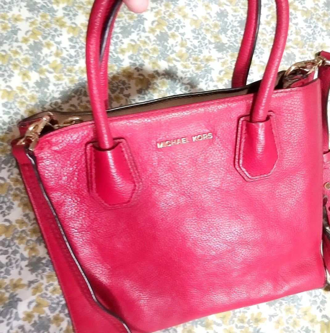 Michael Kors Red Leather Tote Handbag (Category: Tote Bags) located in Manila. Submitted by lene48 (Listing ID 1471224268, Image 1). Description: - Vibrant bright red pebble leather exterior with sleek gold hardware - Secure double top handles and central zippered compartment - Clean beige fabric lining with an embossed metal logo plaque - Durable protective metal feet on the bottom base - Perfect pop of color for any outfitflaw last pic. .