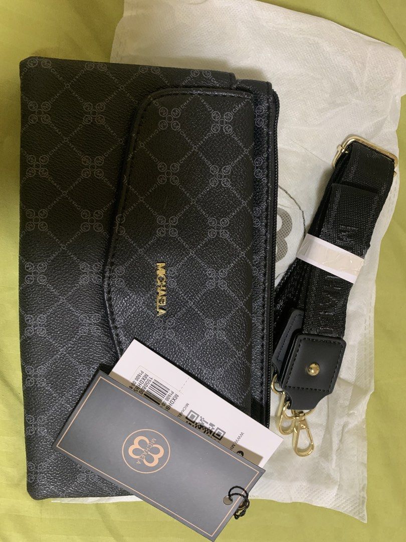 MICHAELA Black Pattern Crossbody Bag with Strap (Category: Cross-body Bags) located in Manila. Submitted by angelyrrehc (Listing ID 1471142076, Image 3). Description: - Brand: MICHAELA - Color: Black with repeating diamond logo pattern & gold-tone hardware - Size: 10x6x1.5inches - Condition: Brand new with original tags (including SM store price tag) and dust bag - Strap: Detachable black branded strap - Storage: Multiple zipped compartments & fr
