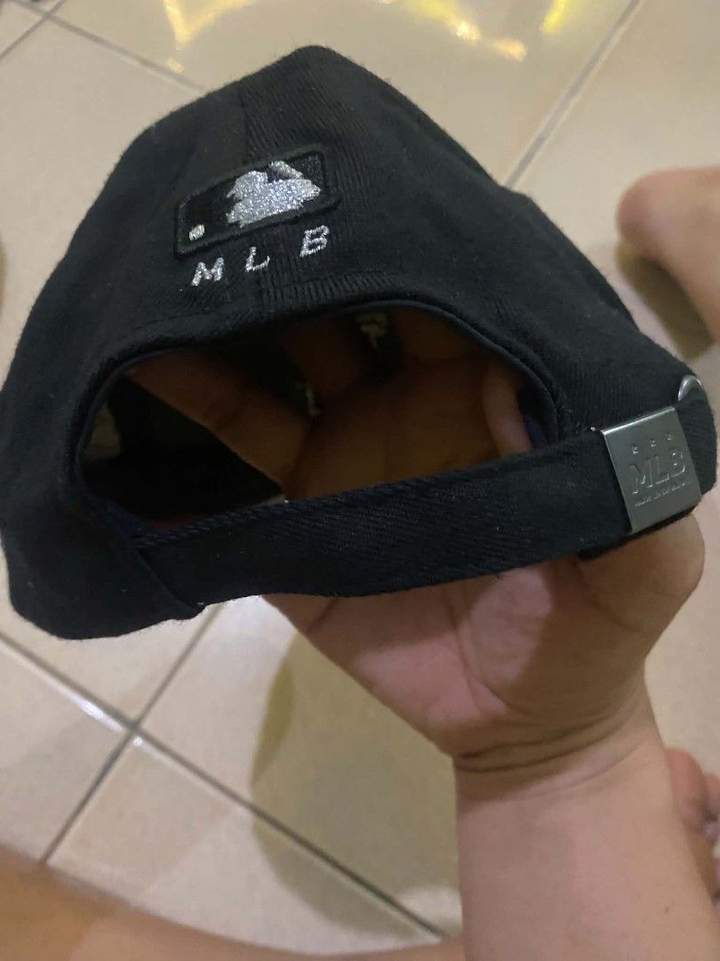 MLB Los Angeles Dodgers Black Baseball Cap (Category: Caps & Hats) located in Quezon City. Submitted by elihur.tuazon (Listing ID 1471291420, Image 3). Description: - Authentic Official MLB Merchandise - Classic black color with embroidered LA Dodgers front logo - Unique Dodgers text printed underneath the brim - Stylish side patch with baseball graphics - Adjustable strap back with metallic branding buckle - Perfect for daily casual wear or game