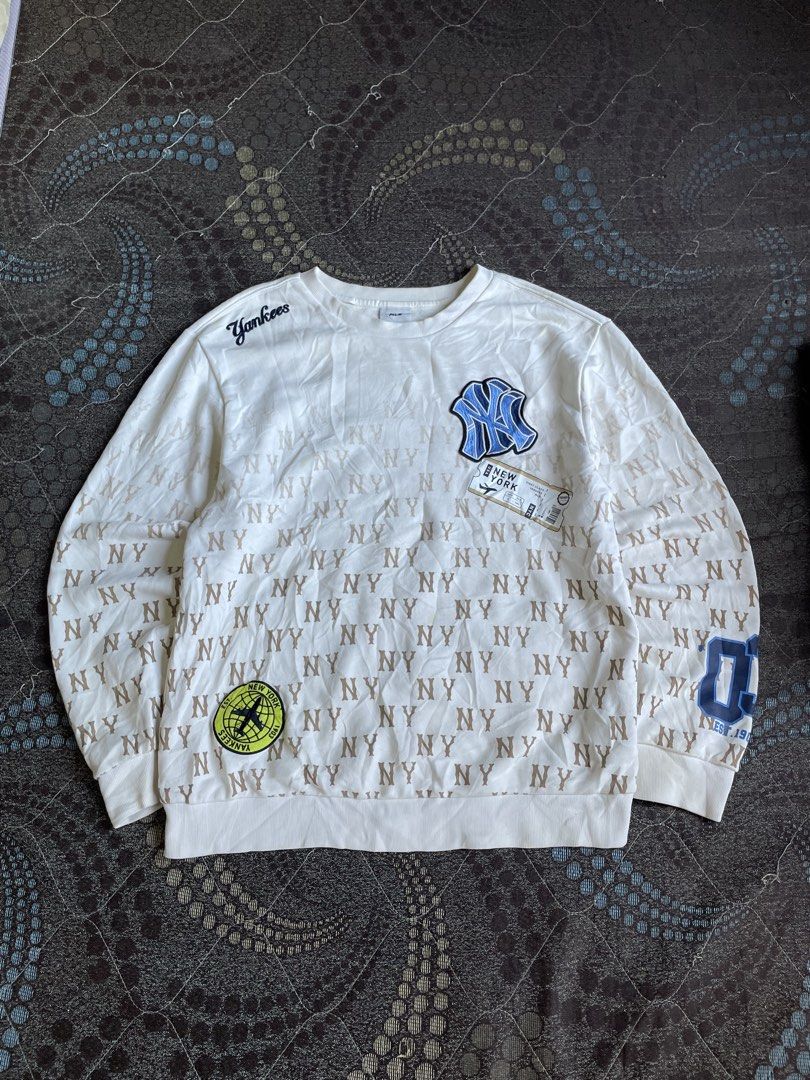 MLB New York Yankees Monogram Sweatshirt (Category: Coats, Jackets and Outerwear) located in Manila. Submitted by chawmichael (Listing ID 1471185269, Image 1). Description: - Authentic MLB New York Yankees white sweatshirt - Eye-catching all-over 'NY' monogram print - Features stylish embroidered patches and printed Yankees lettering - Comfortable ribbed crewneck, cuffs, and hem - Relaxed fit, perfect for casual wear - Condition: Brand new / Exce