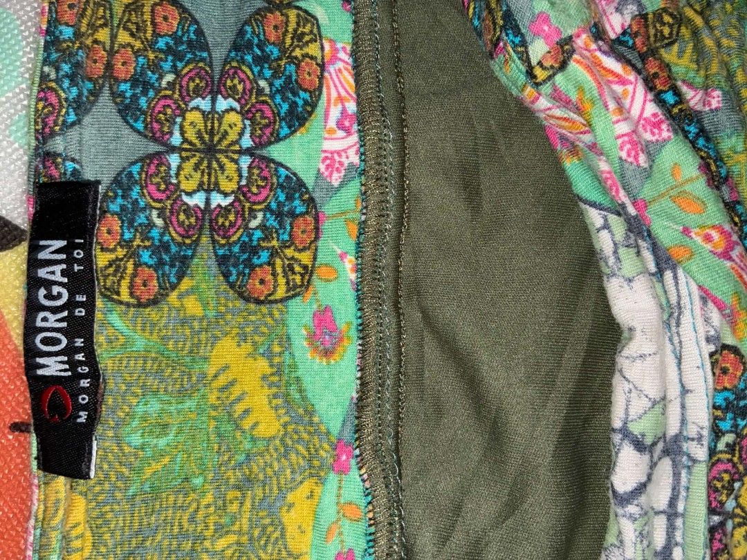 Morgan de Toi Floral Patchwork Printed Flare Skirt (Category: Skirts) located in Nabunturan. Submitted by kairosas85 (Listing ID 1471294551, Image 3). Description: - Brand: Morgan de Toi - Style: Green patterned midi skirt with unique multi-panel design - Print: Mix of floral and abstract patterns all over - Comfort: Lightweight fabric with an olive green inner lining and stretchy elastic waistband - Styling: Easy to pair with basic tops for a ch