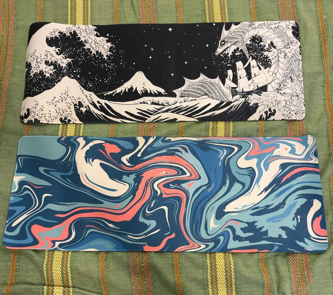 Mousepad Set (Category: Mouse & Mousepads) located in Taguig. Submitted by noblephoenix_e3fda3 (Listing ID 1471207295, Image 1). Description: - Available styles: Japanese wave/dragon art (black and white) or fluid abstract pattern (blue, coral, and white) - Surface: Smooth texture ideal for smooth mouse gliding - Base: Anti-slip rubber backing to keep the mat steady - Size: Spacious enough for both keyboard and mouse setups - Condition: Clean, we