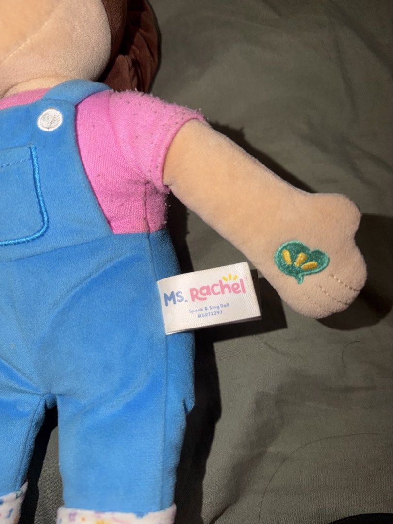 Ms. Rachel Speak and Sing Doll (Category: Plushies & Soft Toys) located in Quezon City. Submitted by shopcjv (Listing ID 1471225863, Image 3). Description: - Official Ms. Rachel Speak and Sing Doll in her classic pink shirt and blue overalls - Features brown hair in a ponytail with a pink headband and interactive hand symbols - Includes original side fabric tag - Condition note: Some minor fuzziness on the pink sleeves - Smoke-free and pet-free h