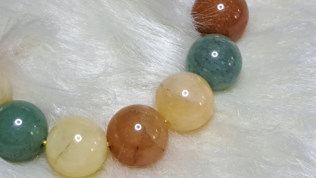 Multicolor Natural Stone Beaded Bracelet (Category: Bracelets) located in Quezon City. Submitted by crystallinehaven (Listing ID 1471140868, Image 2). Description: - Material: Smooth polished natural gemstone beads - Colors: Mixed earth tones (green, orange, yellow, brown) - Fit: Standard stretch elastic fits most wrist sizes - Style: Versatile everyday beaded bracelet - Note: Coin in photos is for size reference only .