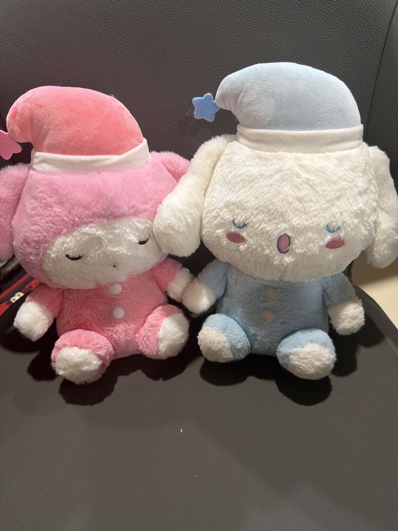 My Melody and Cinnamoroll Sleeping Plush Set (Category: Plushies & Soft Toys) located in San Juan City. Submitted by lilminey (Listing ID 1471222234, Image 1). Description: - Set includes: 2 Sanrio plushies (My Melody in pink & Cinnamoroll in blue/white) - Features: Adorable matching nightcaps, sleepy eyes, blue star accent, and cute button details on outfits - Material: Super soft fur material, sitting design - Bundle deal: Selling both together