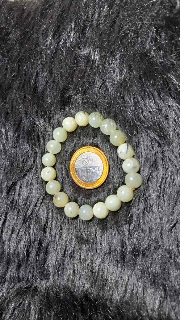 Natural Green Jadeite Beaded Stretch Bracelet (Category: Bracelets) located in Quezon City. Submitted by crystallinehaven (Listing ID 1471141791, Image 2). Description: - Genuine green jadeite gemstone bracelet - Smooth and glossy polished round beads - Convenient slip-on style with stretchy elastic cord - Standard wrist size (fits most) - Features unique natural dark inclusions and matrix spots.