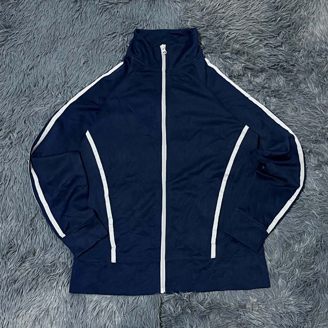 Navy Blue Track Jacket With White Stripes (Category: Coats, Jackets and Outerwear) located in Batangas. Submitted by jaylord_g (Listing ID 1471124163, Image 1). Description: - Color: Dark navy blue with contrasting white stripes and front piping - Fit & Style: Stand-up collar, full zip closure with silver pull, long sleeves with ribbed cuffs - Details: Small white graphic on lower back hem, interior red fabric detail with Japanese text tags - Mat