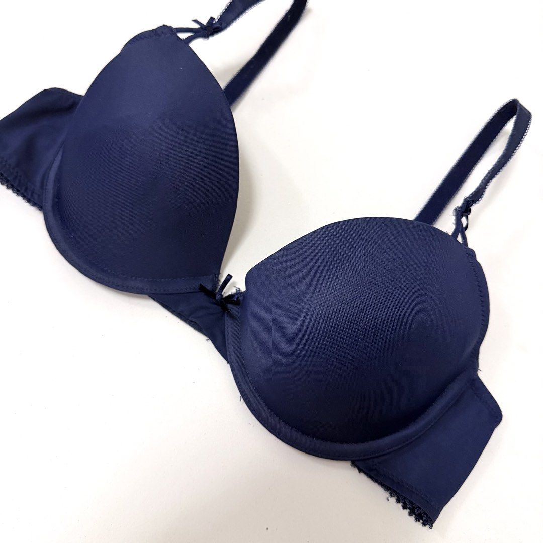 Navy Blue Underwire T-Shirt Bra [34B] (Category: Undergarments & Loungewear) located in Malabon City. Submitted by k_intimates (Listing ID 1471206258, Image 2). Description: Details: • Size 34B / wired / regular padding • Branded, but with a cut label • Navy blue underwire t-shirt bra featuring molded cups, thin adjustable shoulder straps, and a small bow detail at the center gore. .