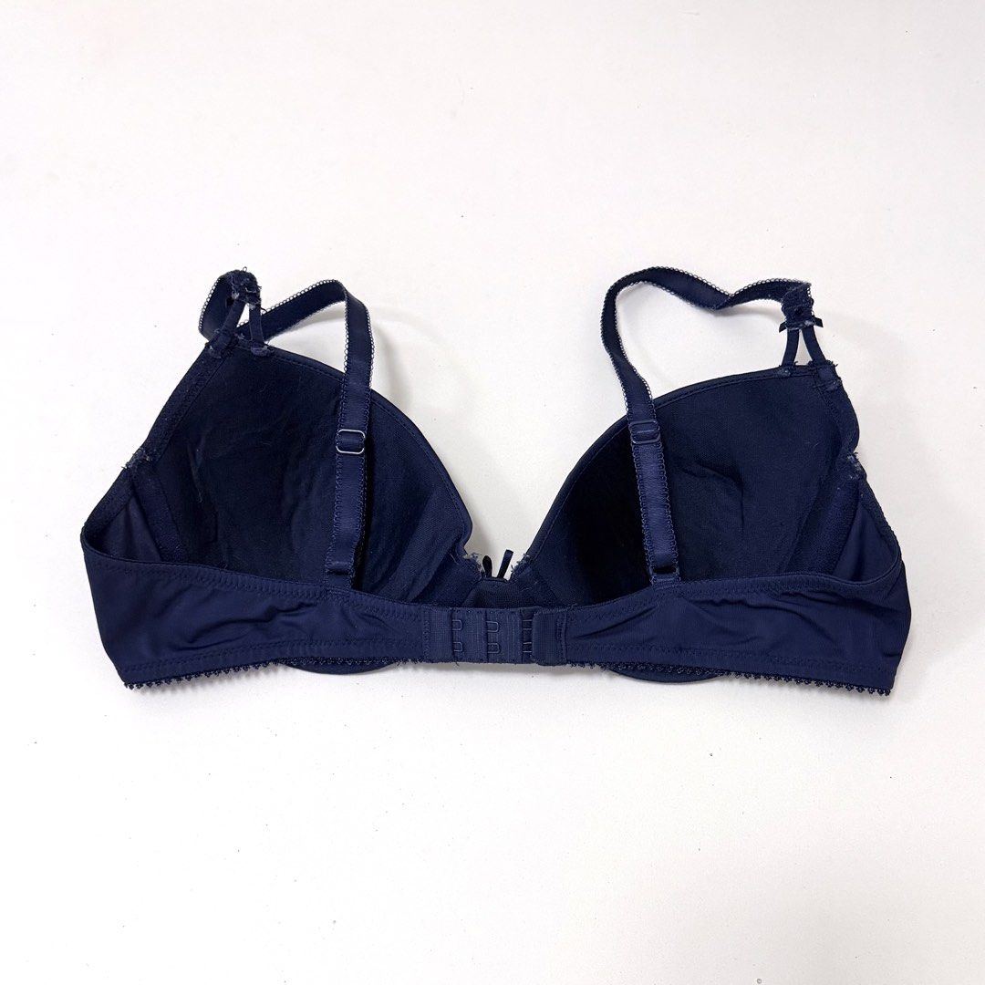 Navy Blue Underwire T-Shirt Bra [34B] (Category: Undergarments & Loungewear) located in Malabon City. Submitted by k_intimates (Listing ID 1471206258, Image 3). Description: Details: • Size 34B / wired / regular padding • Branded, but with a cut label • Navy blue underwire t-shirt bra featuring molded cups, thin adjustable shoulder straps, and a small bow detail at the center gore. .