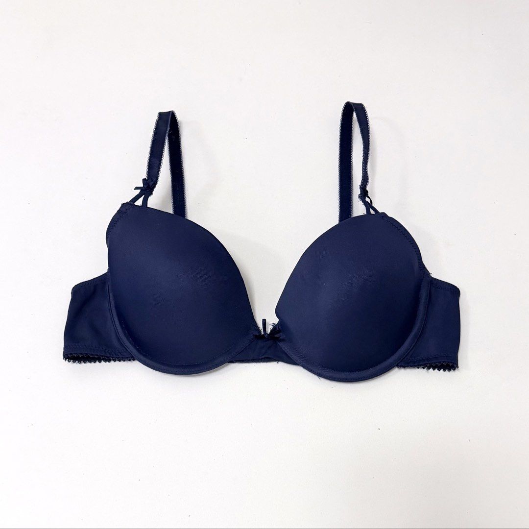 Navy Blue Underwire T-Shirt Bra [34B] (Category: Undergarments & Loungewear) located in Malabon City. Submitted by k_intimates (Listing ID 1471206258, Image 1). Description: Details: • Size 34B / wired / regular padding • Branded, but with a cut label • Navy blue underwire t-shirt bra featuring molded cups, thin adjustable shoulder straps, and a small bow detail at the center gore. .