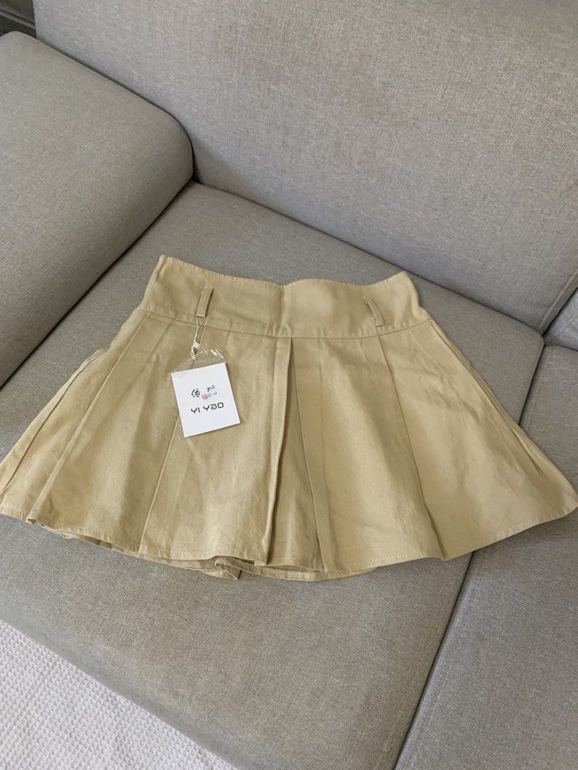 New Khaki y2k skirt (Category: Skirts) located in Paranaque City. Submitted by shoplovedbya (Listing ID 1471208446, Image 1). Description: ♡ Waist: 28-30 ♡ Hips: up to 38 ♡ Length: 14.5 - L on tag - has inner shorts and belt slot .