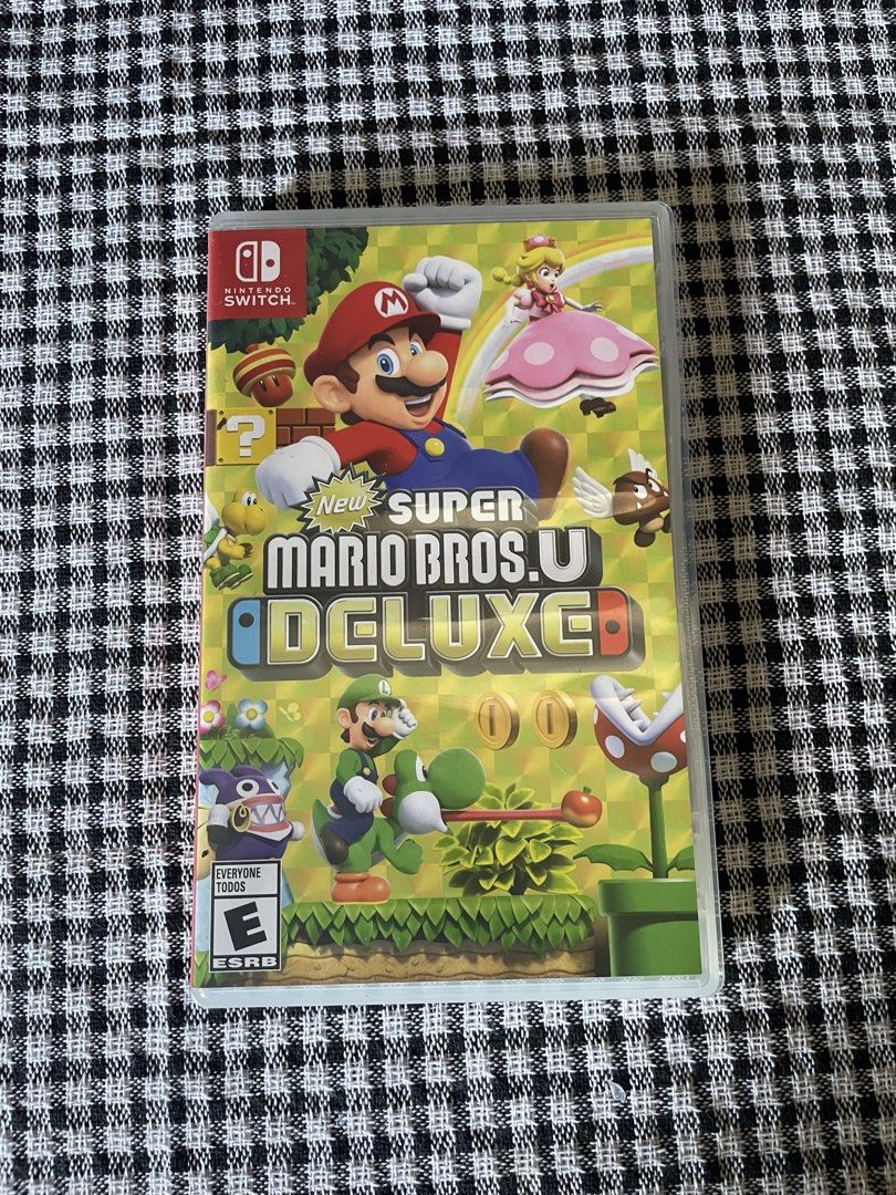 New Super Mario Bros. U Deluxe Nintendo Switch (Category: Nintendo) located in Quezon City. Submitted by ichikahenson (Listing ID 1471258141, Image 1). Description: Delivery fee is shouldered by client - Platform: Nintendo Switch (Game cartridge and original case included) - Condition: Tested and working perfectly - Case Details: Outer artwork intact on front and spine, snaps shut properly - Inclusions: World map insert visible inside the clear p