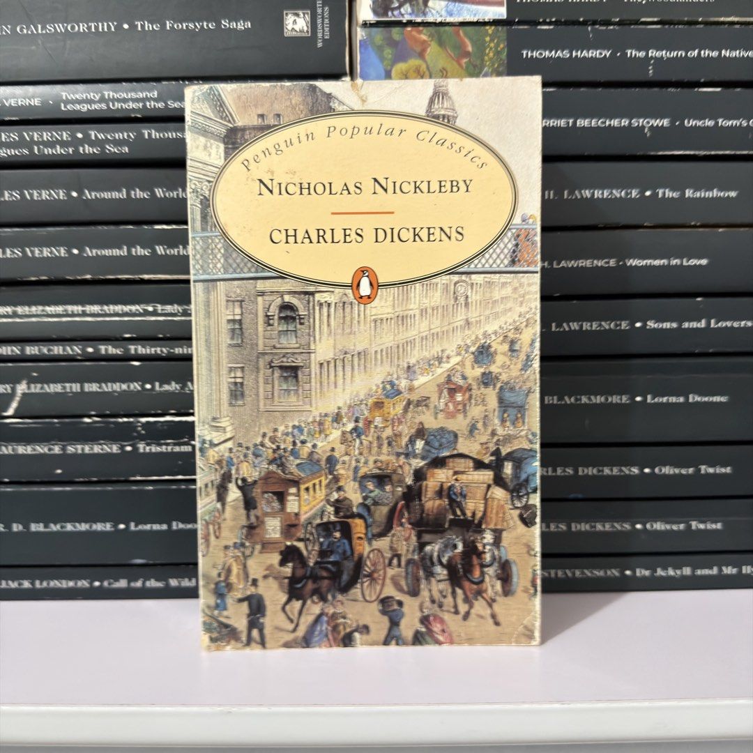 Nicholas Nickleby by Charles Dickens Penguin Popular Classics (Category: Storybooks) located in Lingayen. Submitted by readwjane (Listing ID 1471135873, Image 1). Description: - Title: Nicholas Nickleby by Charles Dickens - Edition: Penguin Popular Classics (Paperback) - Cover Art: Charming 19th-century street scene with horse-drawn carriages and iconic yellow oval title label - Condition: Brand new / Well-maintained classic - Perfect for: Litera