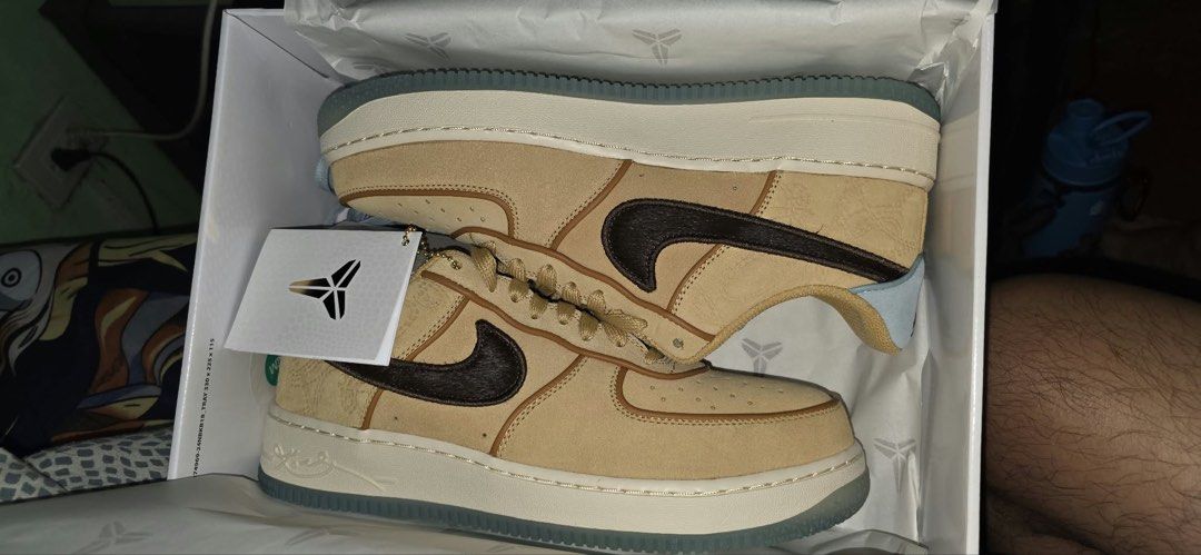 Nike Air Force 1 Low Kobe Bryant (Category: Sneakers) located in Manila. Submitted by adanielbm (Listing ID 1471133907, Image 1). Description: 2x stock size 10 and 11 - Model: Nike Air Force 1 Low Wheat Suede - Design: Dark brown hairy swooshes, light blue heel tab, and tongue patch with embroidered Kobe Bryant sheath logo - Extras: Special horseshoe lace dubrae included - Sole: Clear translucent outsole with signature branding - Condition: Brand
