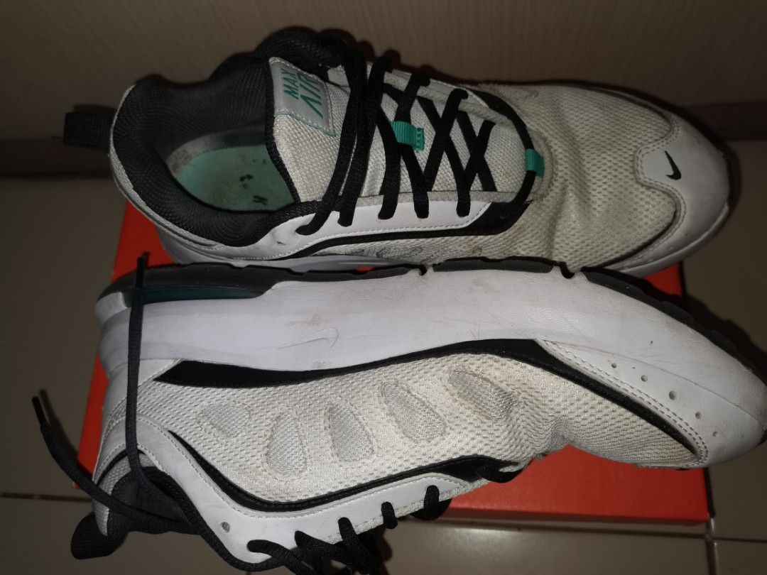 Nike Air Max White Black Teal Sneakers (Category: Sneakers) located in Pasig City. Submitted by raindeclutters (Listing ID 1471260636, Image 2). Description: Nike Air Max sneakers in white with black and teal accents. Mesh upper with black laces. Classic Air unit visible in the sole. Worn a few times, soles show slight dirt. Still lots of life left in them. Comfortable daily wear shoes. Price is negotiable. .