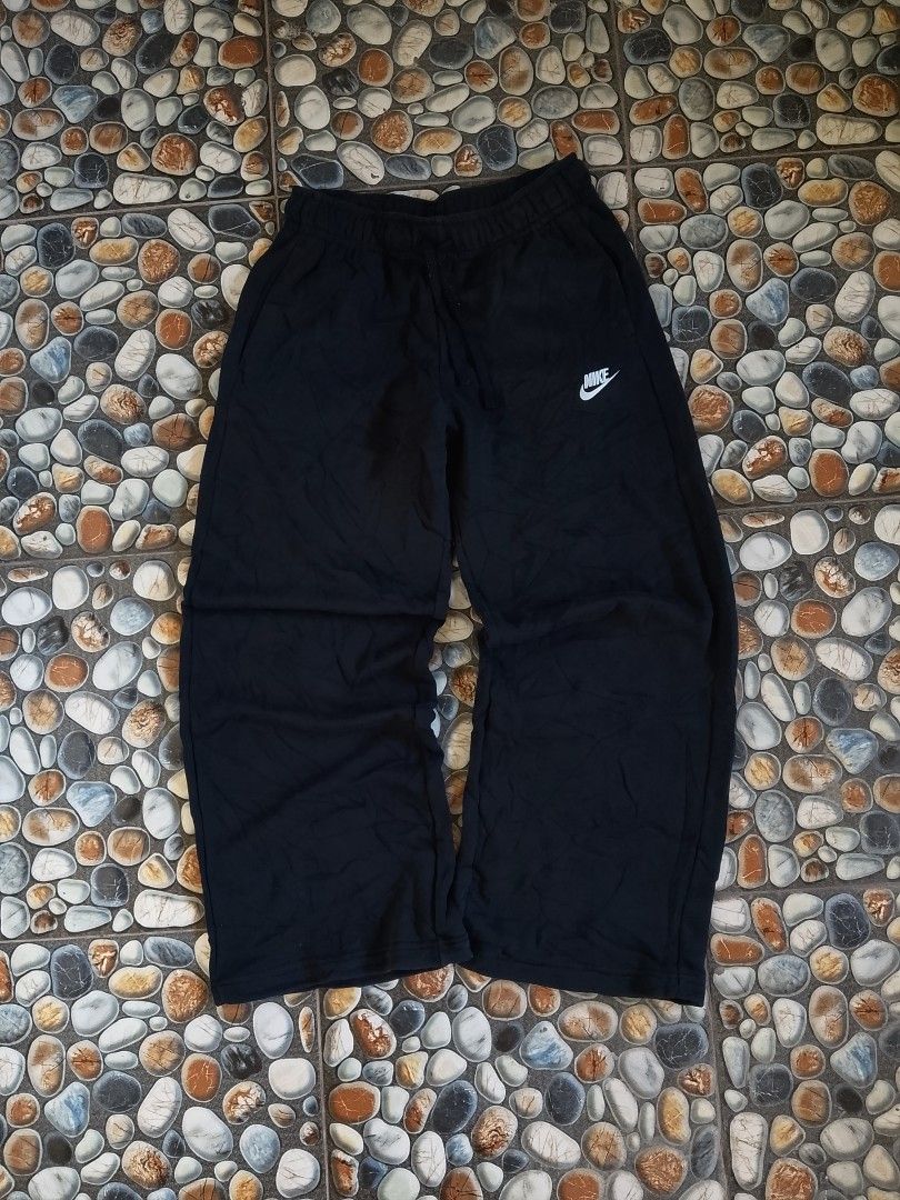 Nike Black Sweatpants Size M FB2728-010 (Category: Joggers) located in Baler. Submitted by vansonearth (Listing ID 1471131489, Image 1). Description: - Brand: Nike - Style: Black sweatpants with white swoosh logo - Size: Medium - Features: Adjustable drawstring waistband - Condition/Origin: Made in China, comfortable casual wear - Ideal for: Everyday lounging, errands, or workouts.