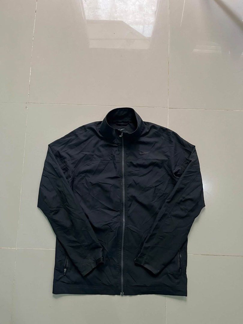 Nike Dri-FIT Black Zip Jacket Size L (Category: Coats, Jackets and Outerwear) located in Lapu Lapu. Submitted by trip-thrift (Listing ID 1471147038, Image 1). Description: Black Nike Dri-FIT zip-up jacket. High collar, full zipper front, zippered side pockets. Tonal swoosh embroidery on the chest. 100 percent polyester fabric. Size L on the tag, fits height 170 to 180 cm. Great lightweight layer for workouts or casual wear..
