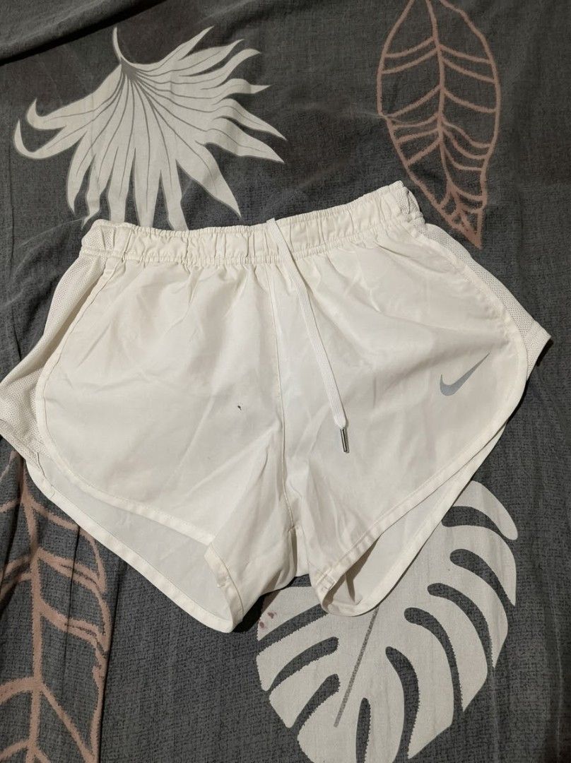 Nike Dri-FIT White Running Shorts (Category: Shorts) located in Urdaneta. Submitted by goldeneagle-e662 (Listing ID 1471199030, Image 1). Description: - Brand: Nike - Type: Running shorts - Color: White with classic silver Nike swoosh - Size: XS - Origin: Made in Malaysia - Material & Tech: Lightweight fabric with Dri-FIT technology - Features: Elastic waistband with adjustable drawstring, breathable mesh side panels - Condition: Clean and ready 