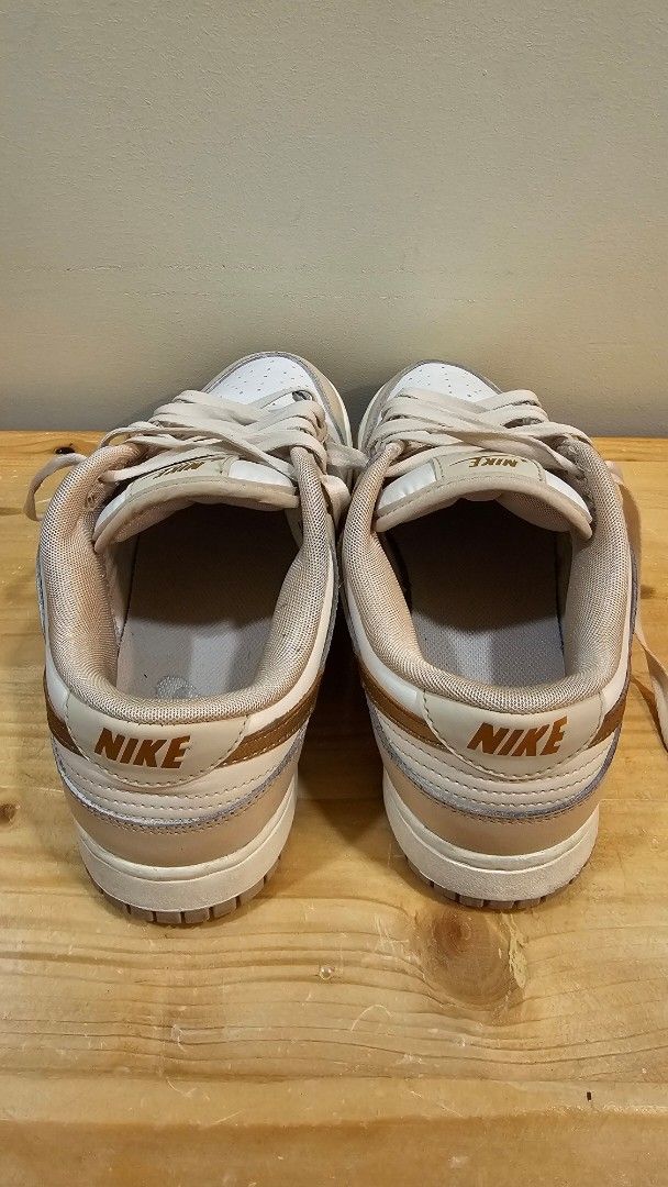 Nike Dunk Low Phantom Metallic Gold (Category: Sneakers) located in Taguig. Submitted by tin50616 (Listing ID 1471226592, Image 3). Description: - Model: Nike Dunk Low - Colorway: Metallic Bronze / Gold / White / Light Beige - Style Code: DX5930-001 - Size: US 8 Women's - Details: White leather base, beige overlays, metallic gold swoosh, branded tongue and heel tabs - Condition: Good silhouette, perfect for daily wear -no box RFS: decluttering.