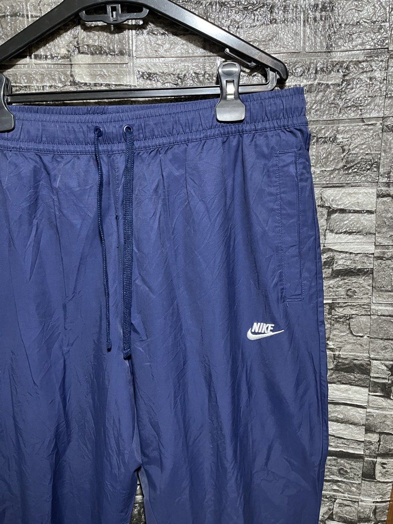 Nike Embroidered Woven Track Pants (Category: Activewear) located in Manila. Submitted by flex_curation (Listing ID 1471138879, Image 2). Description: 36-40W 40L IN VERY GOOD CONDITION BACOOR CAVITE LOC.