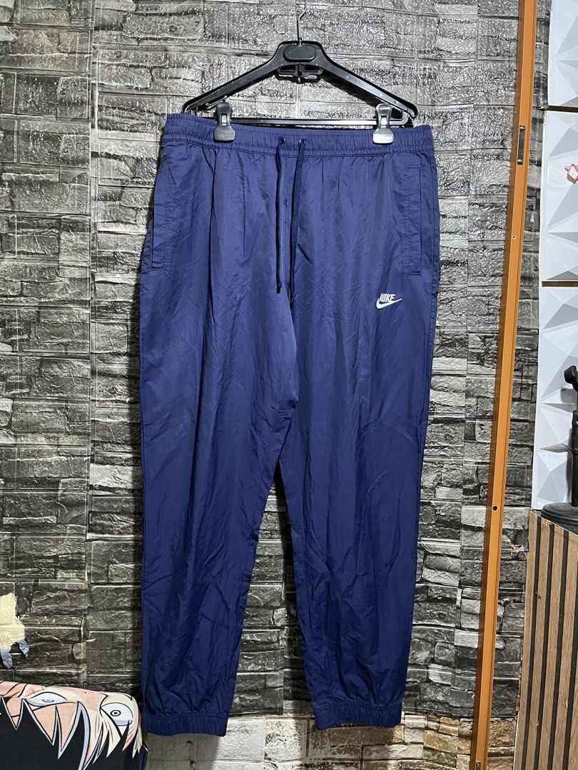 Nike Embroidered Woven Track Pants (Category: Activewear) located in Manila. Submitted by flex_curation (Listing ID 1471138879, Image 1). Description: 36-40W 40L IN VERY GOOD CONDITION BACOOR CAVITE LOC.