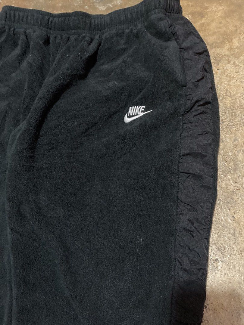 Nike Fleece Sweatpants Black Size L (Category: Joggers) located in Pasay City. Submitted by ken_98 (Listing ID 1471153105, Image 2). Description: W 30-38 L 34 - Brand: Nike - Item: Fleece Sweatpants - Color: Black with contrasting textured side panels - Size: Large (L) - Style Code: DD4892-010 - Features: White embroidered Nike swoosh, elastic waistband, and ankle cuffs - Material: Cozy fleece - Origin: Made in Vietnam - Condition: Great for casu