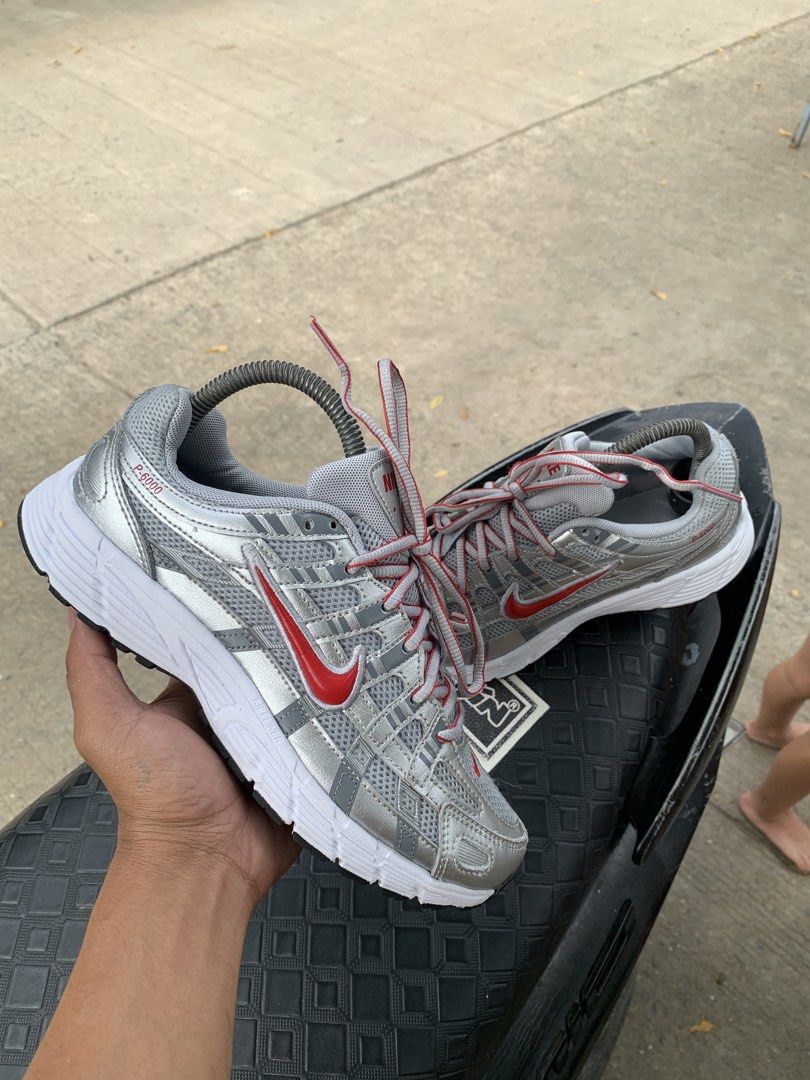 Nike P-6000 Silver Red Sneakers (Category: Community) located in Cagayan de Oro. Submitted by jename15 (Listing ID 1471138778, Image 1). Description: - Brand: Nike - Model: P-6000 - Colorway: Metallic Silver with Red Swoosh accents, white midsoles, and black outsoles - Materials: Grey mesh upper with structured silver overlays and red/grey striped laces - Condition: Clean soles and uppers - Style: Comfortable retro runner, perfect for daily wear 