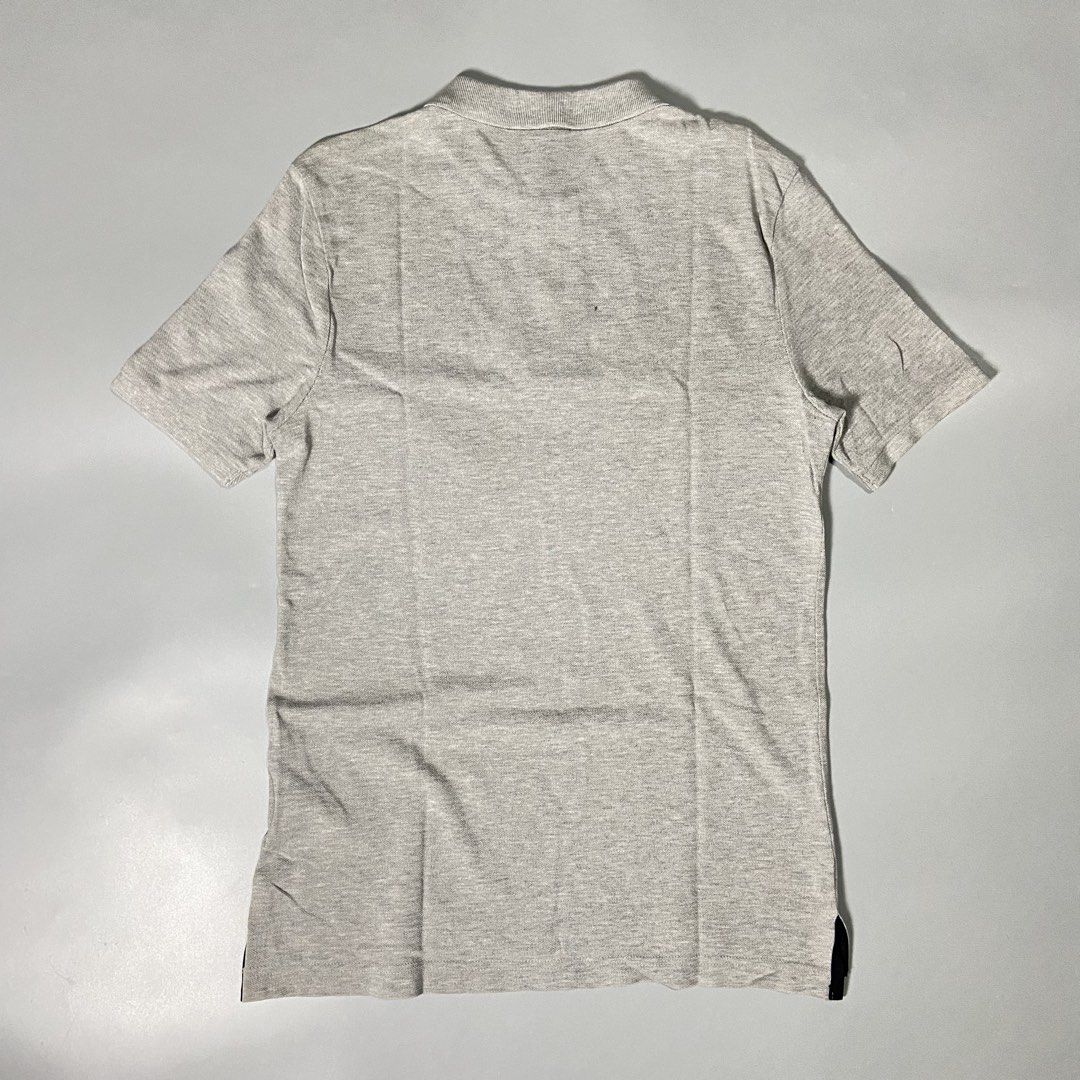 Nike Polo Shirt in Gray (Category: Tshirts & Polo Shirts ) located in Taguig. Submitted by workwearheads (Listing ID 1471154402, Image 2). Description: 🏷️Tag size: Small ▪️Width: 18 ▪️Length: 27 Front 28 Back (Long back) ▪️Color rate: 10/10 ▪️Issue: minor stain need wash (see last photo) ▪️Excellent Condition.