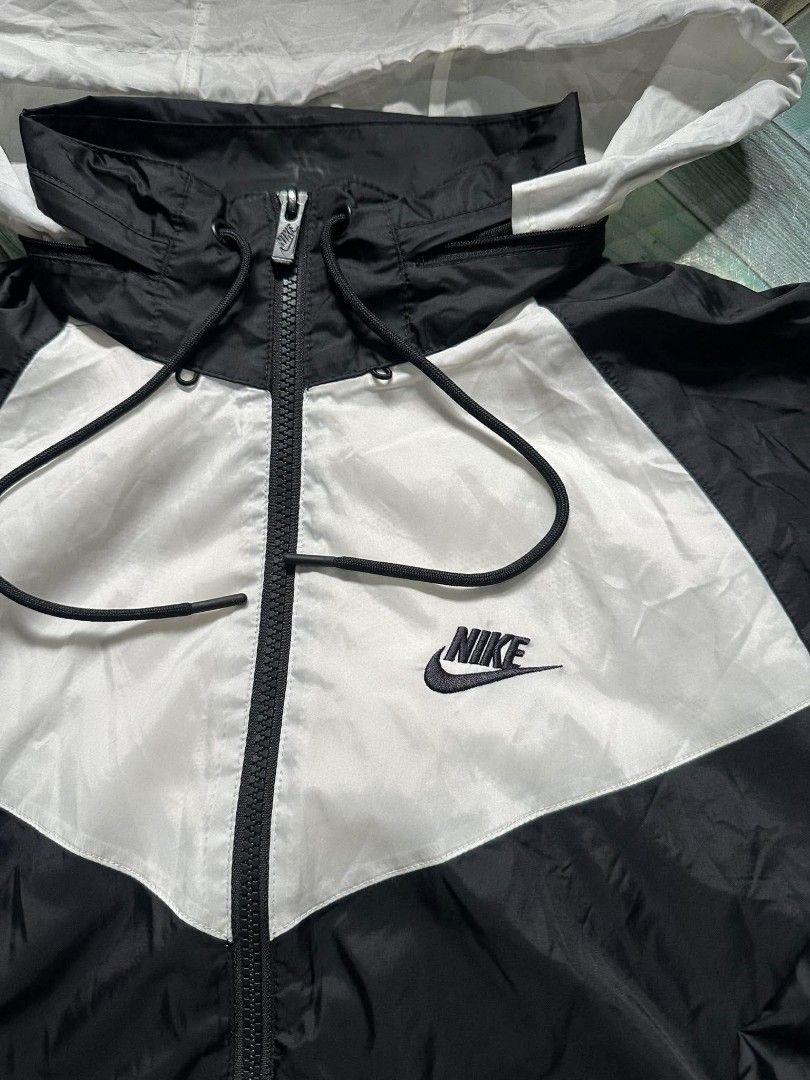 Nike Windrunner Jacket Black White Hooded (Category: Coats, Jackets and Outerwear) located in Caloocan City. Submitted by joshuapong16798 (Listing ID 1471163242, Image 2). Description: width:23 length:26 excellent condition issue:good fade sa baba .