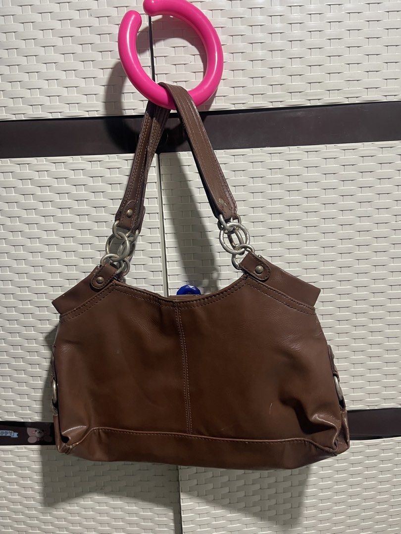 Nine West Brown Shoulder Bag (Category: Shoulder Bags) located in Manila. Submitted by mawiya.v (Listing ID 1471166314, Image 3). Description: bought this here on carousell but my ipad wont fit so benta ko na lang uli - Mode of Payment: BPI, GCash, - Shipping: Via J&T Express (Buyer shoulders shipping fee) or same-day delivery within Metro Manila.