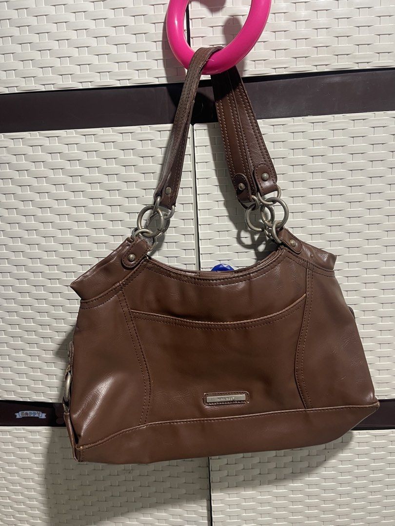 Nine West Brown Shoulder Bag (Category: Shoulder Bags) located in Manila. Submitted by mawiya.v (Listing ID 1471166314, Image 1). Description: bought this here on carousell but my ipad wont fit so benta ko na lang uli - Mode of Payment: BPI, GCash, - Shipping: Via J&T Express (Buyer shoulders shipping fee) or same-day delivery within Metro Manila.