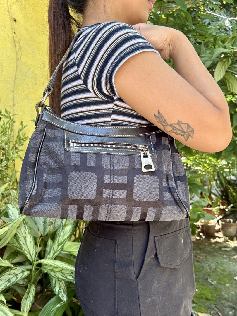 Nine West Monogram Geometric Shoulder Bag (Category: Shoulder Bags) located in Manila. Submitted by dorilorenr48954 (Listing ID 1471219454, Image 1). Description: - Brand: Authentic Nine West - Design: Black and grey geometric pattern with black faux leather trim - Closure: Secure top zip main compartment - Pockets: Exterior front zip pocket with branded pull tab + interior zip pocket - Interior: Fully lined in black fabric - Condition: Tagged wi