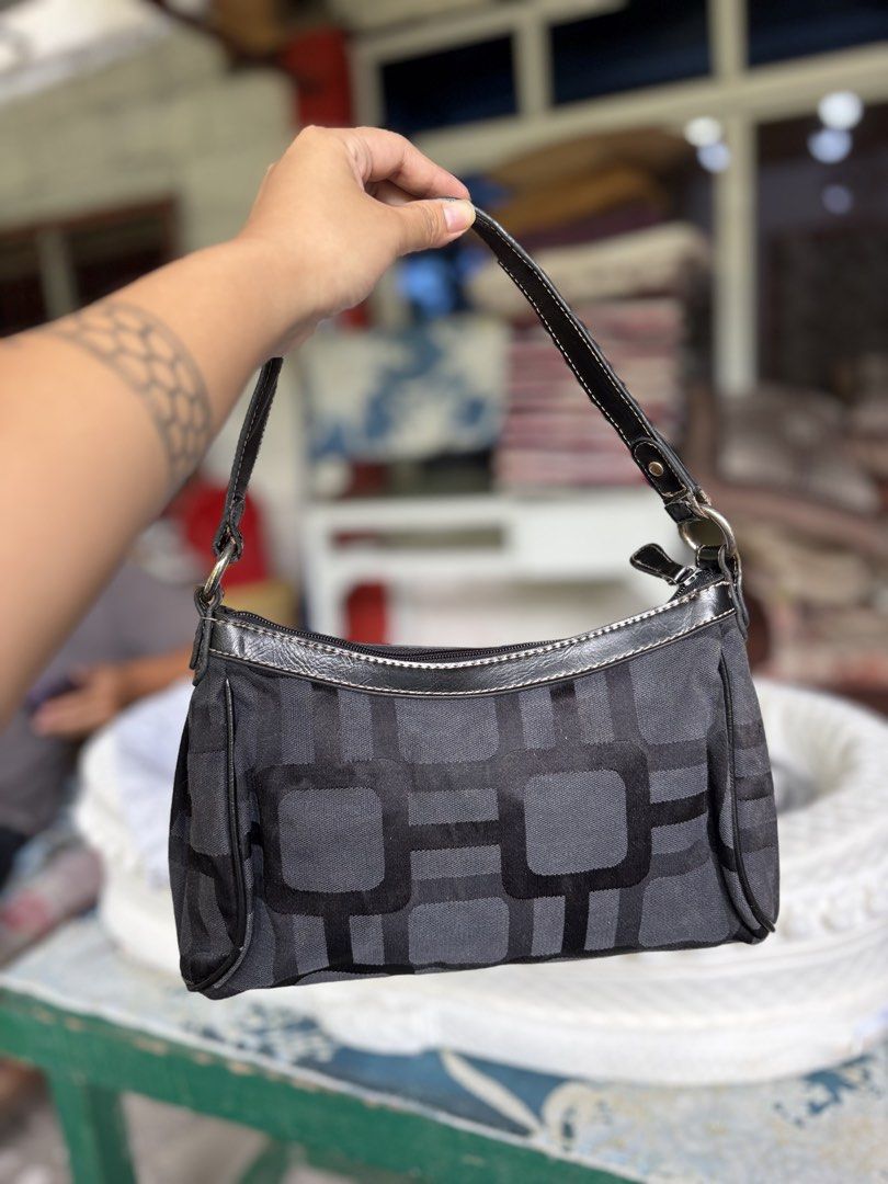 Nine West Monogram Geometric Shoulder Bag (Category: Shoulder Bags) located in Manila. Submitted by dorilorenr48954 (Listing ID 1471219454, Image 2). Description: - Brand: Authentic Nine West - Design: Black and grey geometric pattern with black faux leather trim - Closure: Secure top zip main compartment - Pockets: Exterior front zip pocket with branded pull tab + interior zip pocket - Interior: Fully lined in black fabric - Condition: Tagged wi