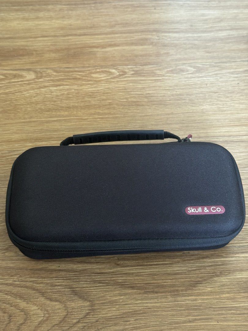 Nintendo Switch Lite Gray with Skull & Co Case and Charger (Category: Nintendo) located in Caloocan City. Submitted by lounarcisom (Listing ID 1471255815, Image 2). Description: - Item: Nintendo Switch Lite (Gray) - Condition: 10/10 - Original wall charger, and box - Black Skull & Co carrying case with secure zipper - Thumb Grip Skull & Co - Perfect for handheld gaming on the go - Protective case - Meetup or shipping options available (PM for det