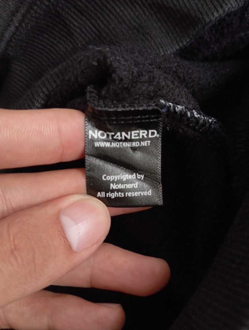 NOT4NERD Black Graphic Hoodie Size M (Category: Coats, Jackets and Outerwear) located in Guihulngan. Submitted by jaylordfra13193 (Listing ID 1471274899, Image 3). Description: - Brand: NOT4NERD - Size: Medium (Standard pullover fit) - Color: Black with a large white graphic print on the chest - Comfort: Soft fleece interior lining to keep you warm - Features: Adjustable drawstring hood and front kangaroo pocket - Condition: Well-maintained, read