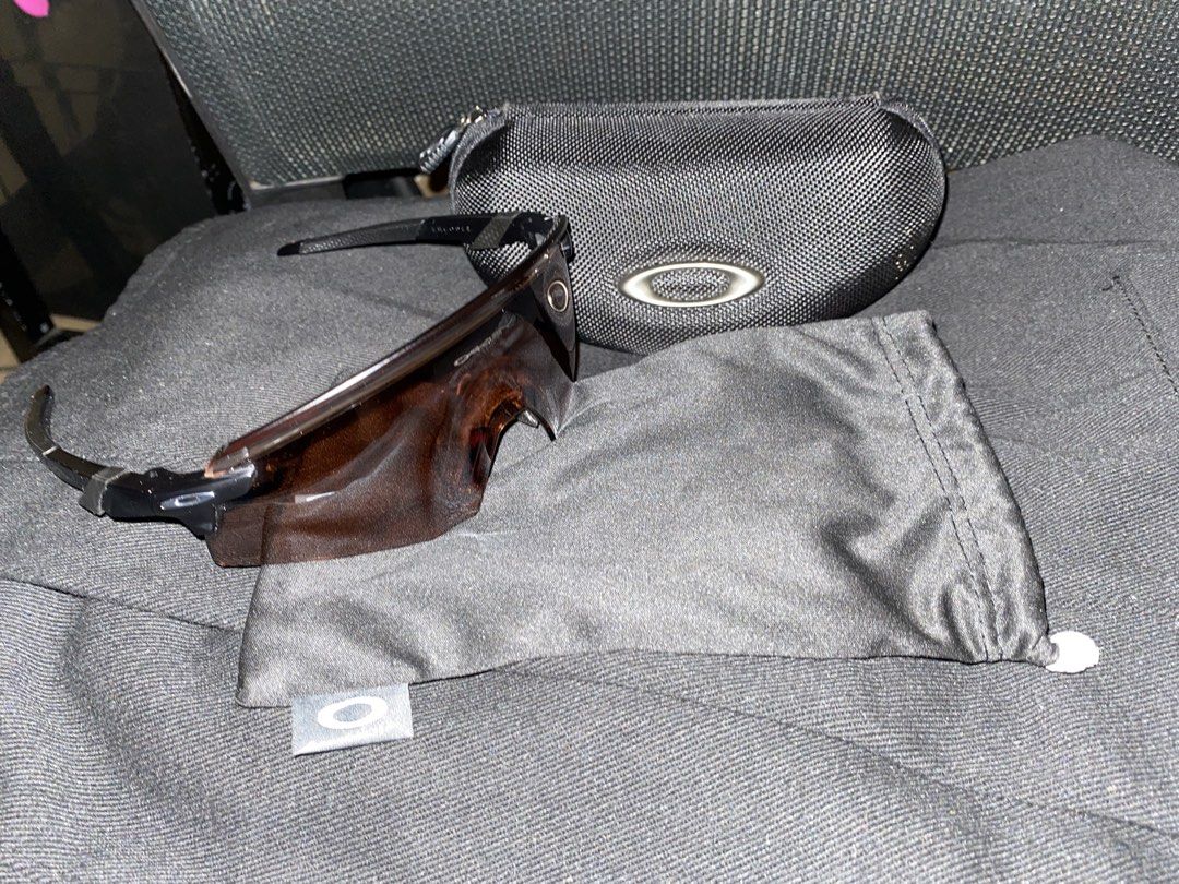 Oakley encoder brown from italy (Category: Sunglasses & Eyewear) located in Batangas. Submitted by zioniriesales (Listing ID 1471231941, Image 2). Description: - Authentic Oakley sports sunglasses in black frames with brown tinted shield lenses - Wrap-around design provides maximum peripheral vision - Pristine condition: frames and lenses are clean with no scratches spotted - Includes original black zippered hard case - Comes with original microf