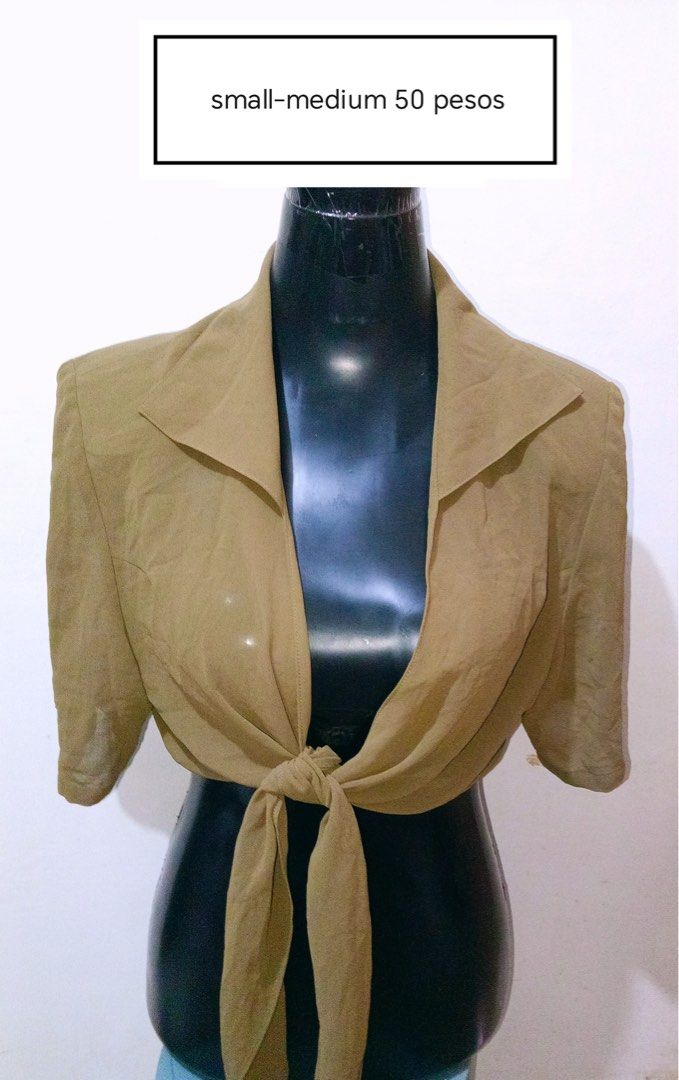 Olive green tie-front crop top small medium (Category: Sleeveless) located in Quezon City. Submitted by charitoo369 (Listing ID 1471294659, Image 1). Description: - Color: Olive green - Style: Crop top with short sleeves and pointed collar - Detail: Front tie closure with long fabric straps - Material: Lightweight and slightly sheer - Fit: Best for small to medium frames - Condition: Clean and ready to wear Na cut tag pero this is imported and br