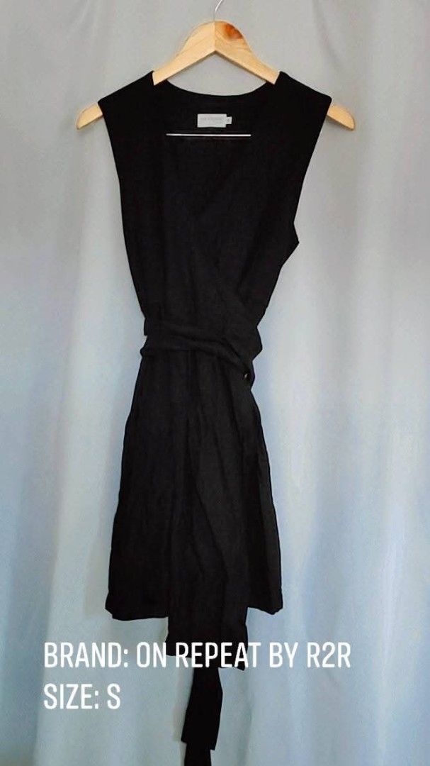 On Repeat By R2R Black Wrap Dress Size S (Category: Dresses) located in Bacoor. Submitted by stargazer1084 (Listing ID 1471275922, Image 1). Description: - Brand: On Repeat by R2R - Color: Classic Black - Style: Sleeveless V-neck wrap dress with matching fabric tie belt - Length: Knee-length - Material: Lightweight and comfortable - Versatility: Perfect for both casual days and office/work wear - Condition: Excellent.