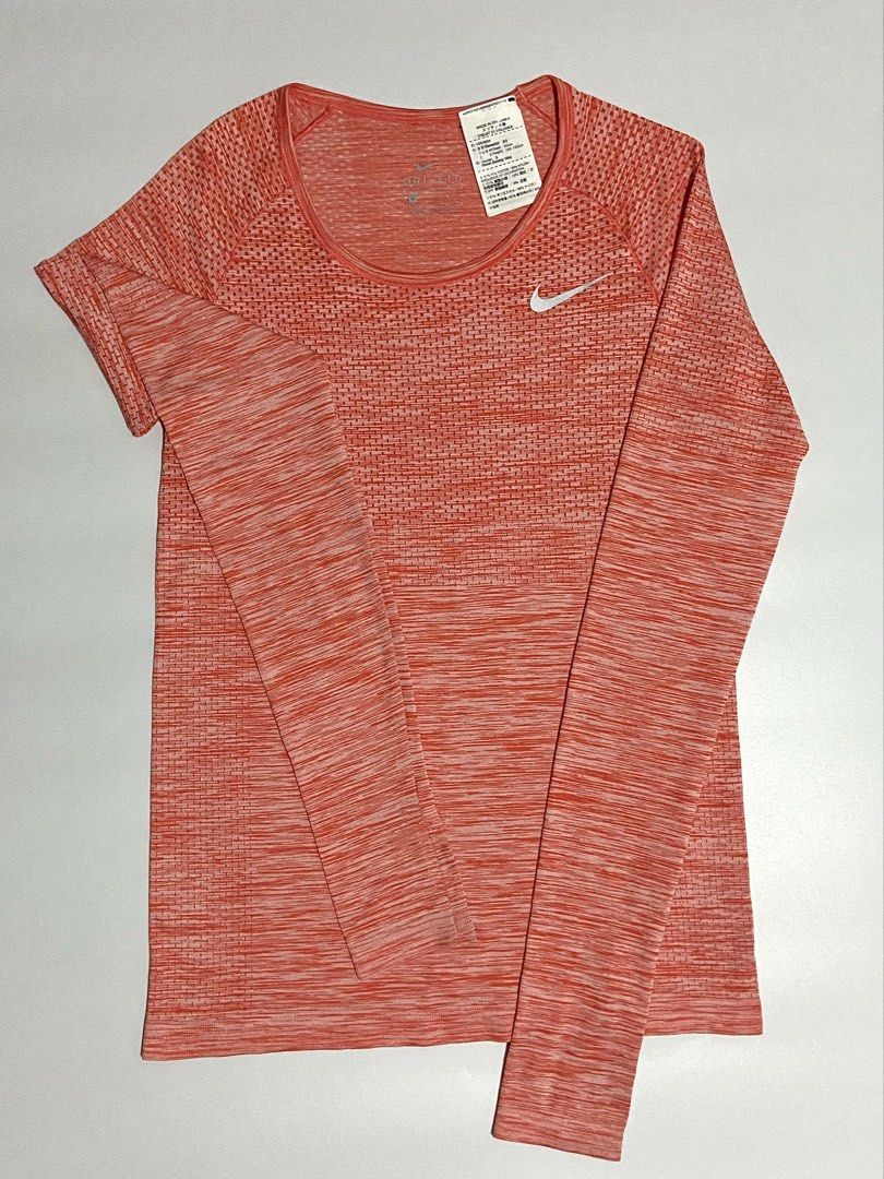 Orange Nike Drifit Long-sleeve (Category: Activewear) located in Davao. Submitted by sb.thriftwear (Listing ID 1471147498, Image 2). Description: Size: Small Dimensions: W- 15” L- 24” Issue: None. Good as new Color may vary due to lighting. ⚠️All items are thrifted. Please manage your expectations..