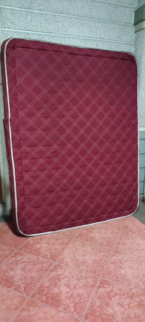 Orthopedic Red Mattress (Category: Bed Frames & Mattresses) located in Manila. Submitted by michaelde.guzman (Listing ID 1471226365, Image 2). Description: - Type: Red orthopedic mattress - Design: Quilted diamond pattern with white piping trim - Condition: Sturdy build with some loose threads and general fabric wear - Ideal For: Guest rooms or spare beds - Note: Buyer must arrange own transport for collection.