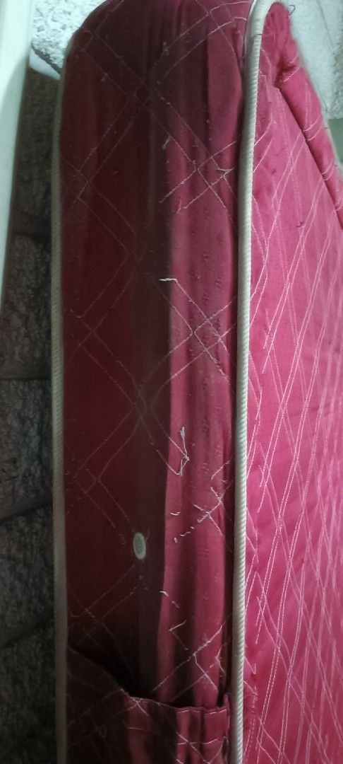 Orthopedic Red Mattress (Category: Bed Frames & Mattresses) located in Manila. Submitted by michaelde.guzman (Listing ID 1471226365, Image 3). Description: - Type: Red orthopedic mattress - Design: Quilted diamond pattern with white piping trim - Condition: Sturdy build with some loose threads and general fabric wear - Ideal For: Guest rooms or spare beds - Note: Buyer must arrange own transport for collection.