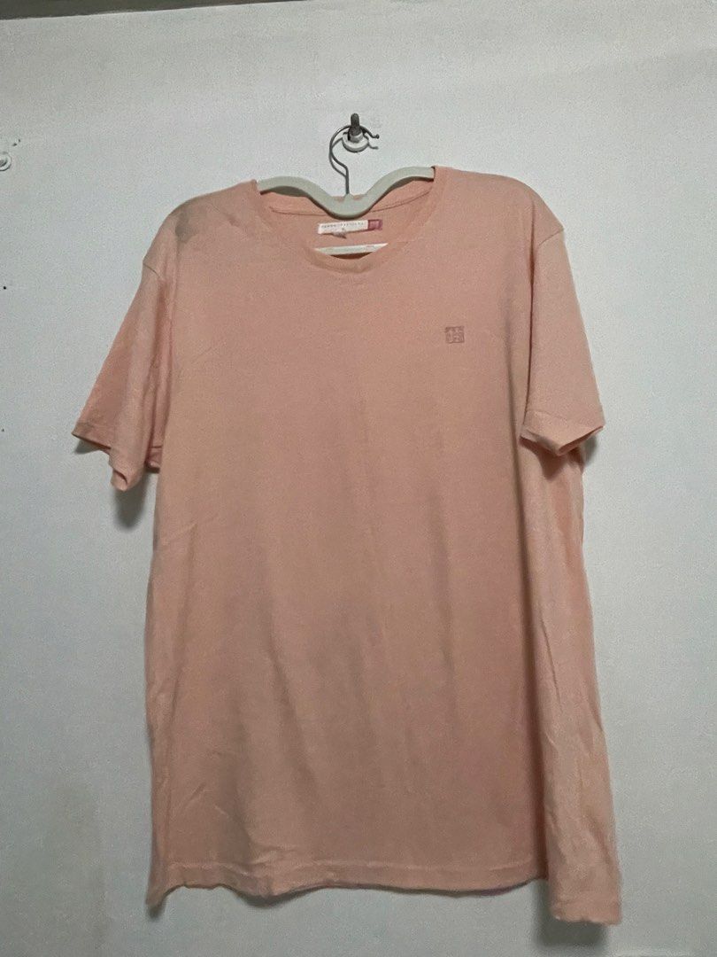 Peach Short Sleeve T-Shirt (Category: Shirts) located in Manila. Submitted by seanjcc (Listing ID 1471216695, Image 1). Description: - Color: Peach - Fit: Regular fit with crew neckline - Material: Soft, breathable, and lightweight cotton - Design: Subtle embroidered detail on the left chest - Versatility: Easy to style with jeans or shorts for everyday casual wear.