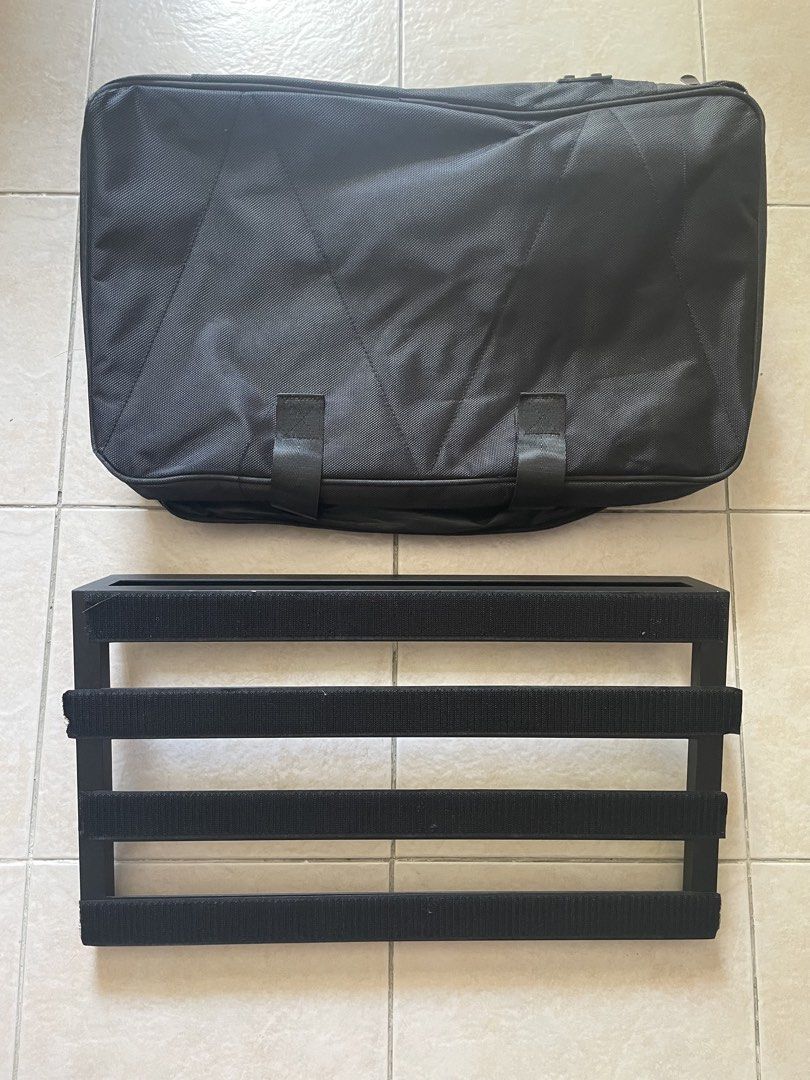 Pedalboard with Carrying Bag (Category: Musical Instruments) located in Quezon City. Submitted by ichikahenson (Listing ID 1471257300, Image 1). Description: Delivery fee is shouldered by client - Durable black metal frame with 4 horizontal slats - Pre-covered with loop velcro for easy pedal placement - Includes matching black nylon carrying bag with zipper and handle - Fits standard guitar effects pedals securely - Ideal and road-ready for gigs 