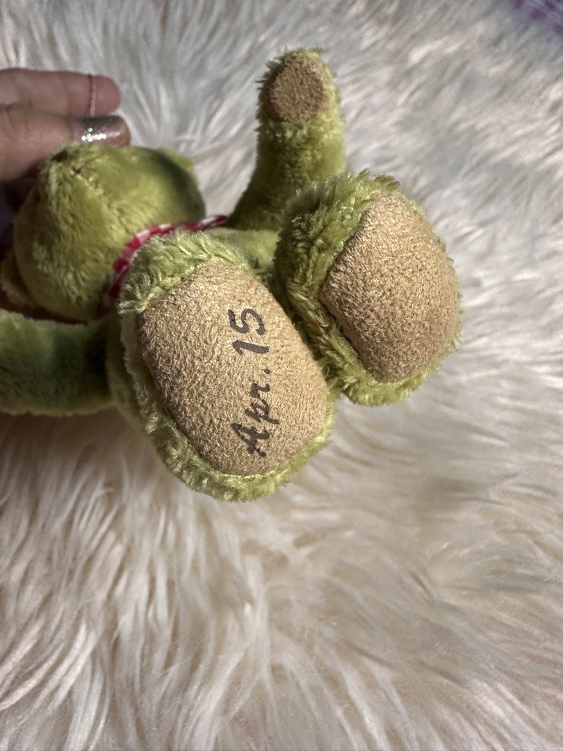 Petit Coup cute green plush teddy bear keychai (Category: Plushies & Soft Toys) located in Davao. Submitted by favoritepreloved (Listing ID 1471268407, Image 3). Description: 💜 wearing a red-and-white gingham checkered scarf and attached to a colorful braided strap..