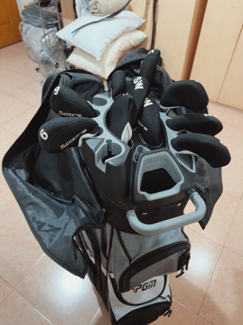 PGM Pro Golf Master Golf Bag with Clubs (Category: Golf) located in Manila. Submitted by theclassicme (Listing ID 1471155357, Image 1). Description: - Brand/Model: PGM Pro Golf Master Cart Bag - Colorway: Stylish Black, Grey, and White - Organization: Integrated divider top keeps your clubs neatly separated - Storage: Multiple zippered pockets for all your gear, balls, and tees - Convenience: Sturdy top handle and built-in umbrella slot - Protect