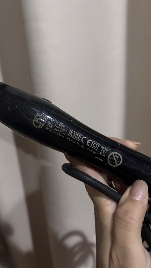 Philips CurlControl Curling Iron HP8605 (Category: Hair) located in Makati City. Submitted by kaysgarage (Listing ID 1471219171, Image 3). Description: - Brand/Model: Philips CurlControl HP8605 - Design: Black and white handle with adjustable temperature settings - Barrel: Standard barrel with secure clamp - Voltage: Universal 110-240V (great for travel) - Condition: Powers on and heats up properly; minor scuffs on the black plastic from storage 