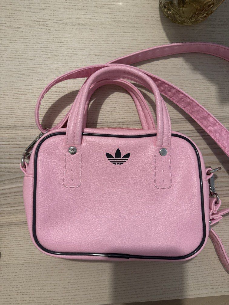 Pink adidas handbag (Category: Cross-body Bags) located in Manila. Submitted by coolcloud.e6133a (Listing ID 1471194302, Image 1). Description: Only used once, can be used as handbag or cross body as the strap is removable.